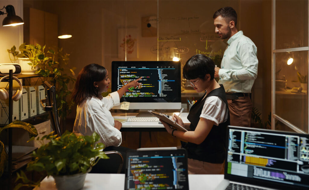 Team collaborating on digital strategy and creative web development in a modern workspace